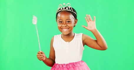 Children, wave and wand with a girl on a green screen background in studio playing fantasy or dress...