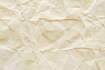 A sheet of beige wrinkled kraft paper texture as background
