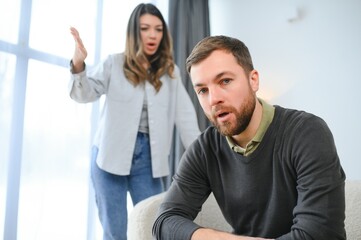 Family conflict, quarrel, misunderstanding. The woman shouts at her husband, in despair, crying