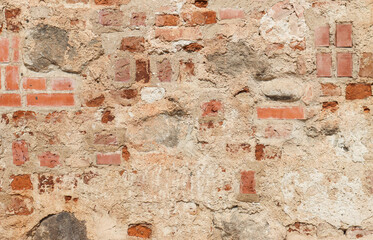 An ancient, abandoned, brick-stone wall.