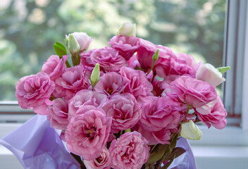 Beautiful bouquet of bright pink and white eustoma flowers . Romantic gift