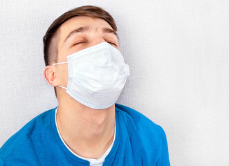 Tired Young Man in Flu Mask - 746695683