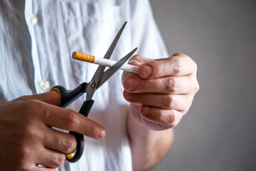 Person cutting a Cigarette with Scissors - 746695867