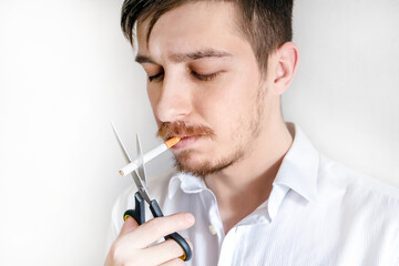 Man cutting a Cigarette with Scissors - 746695884