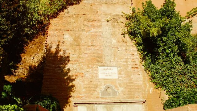 Establishing shot of the Alhambra Palace in Granada, Andalucia, Spain captures its stunning Moorish Nasrid architecture