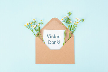 Thank you card, german language, envelope surrounded by spring flowers, being thankful, support,...