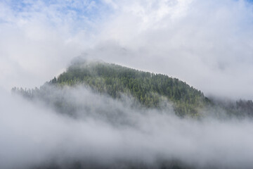 A mountain in the fog