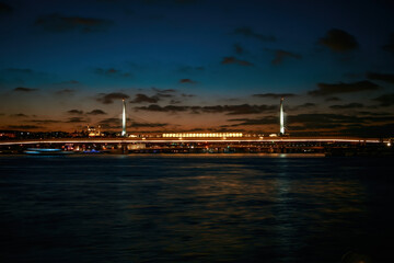 Istanbul skyline with Golden Horn Metro Bridge at night.