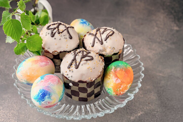 Easter chocolate cupcakes with colored eggs. Easter cupcakes with vanilla frosting, candy eggs and...