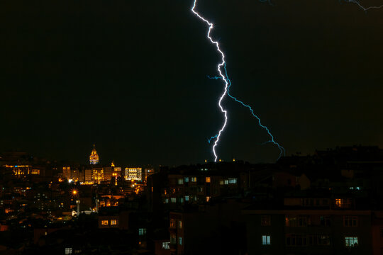 A powerful electric shock hits the city center with multiple lightning strikes near the Istanbul Galata tower..