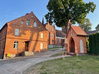 A historic church made of red brick.