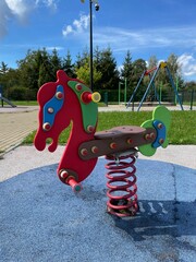 A toy standing on the playground.
