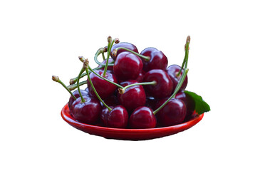 Red cherries in a bowl on a white background