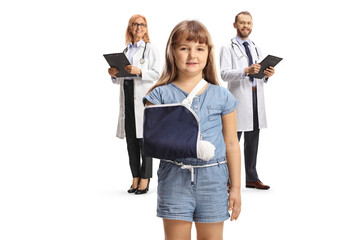 Doctors and a girl with a broken arm wearing a sling