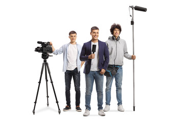 Man with a microphone and a team of boom and camera operators with recording equipment