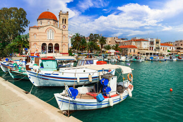 Saronics islands of Greece .Authentic beautiful Greek island -Aegina with traditional fishing boats and St. Nicholas Church. - 746725625