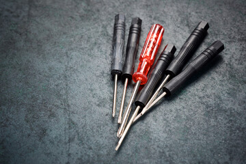 Metal precision screwdriver group on a  table