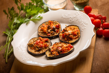 oven grated eggplants with fresh tomatoes and cheese