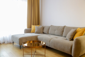 Modern cozy apartment with a touch of yellow, living room with sofa and dining table,	 - 746736022