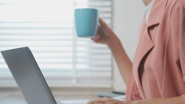 Charming woman with beautiful smile reading good news on mobile phone during rest in coffee shop, happy Caucasian female watching her photos on cell telephone while relaxing in cafe during free time