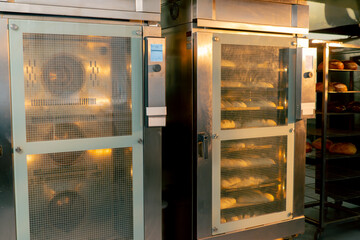 in professional kitchen the process of preparing bread in the oven fan mode