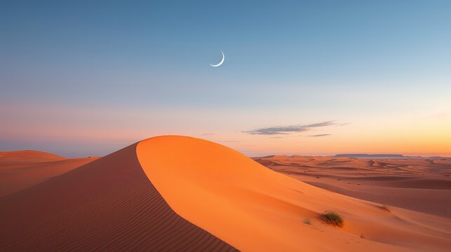 The orange sand dunes of the Sahara Desert in Merzouga, Morocco, stretch endlessly under the serene crescent moon. This breathtaking scene captures the vastness and beauty of the desert landscape