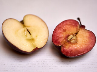Fresh apple cut in half on a table