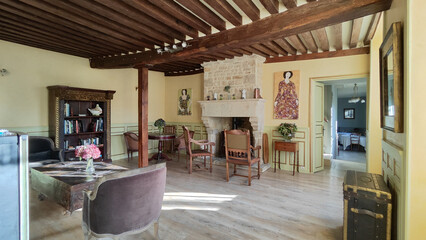 Living room of an old rustic town house of a wealthy person. Large living room with beam and wooden...