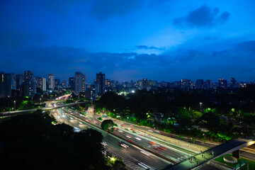 Aerial night view of Av. 23 de Maio, in Sao Paulo, Brazil, with Ibirapuera Park on the right