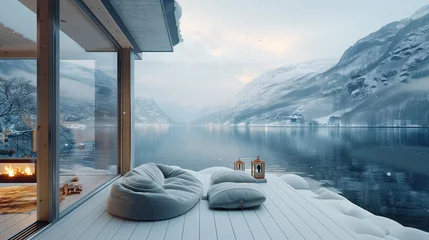 Foto op Canvas The interior of a beautiful terrace of a penthouse, a winter Norwegian fjord on the background, snowfall outside © mikhailberkut