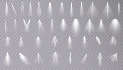 Set of isolated spotlight light effects. White glowing spotlight on a transparent background.	