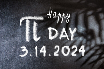 Happy Pi Day text on blackboard background. Happy National Pi Day, March 14, 2024. Holiday concept.