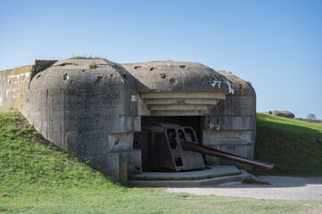 German bunker of Longues-sur-Mer battery (Batterie de Longues-sur-Mer) with a rusty cannon pointing