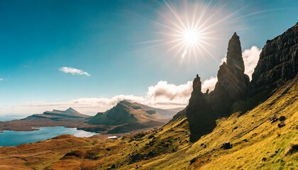 mountain panorama with sun in scotland isle of skye old man of storr - obrazy, fototapety, plakaty