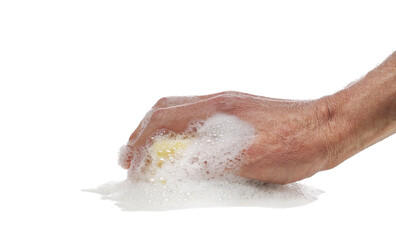 Hand holding yellow sponge wet with foam isolated on white background