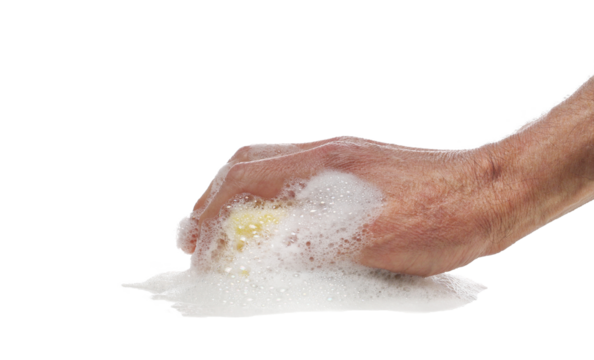 Hand holding yellow sponge wet with foam isolated on white background