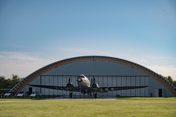 Detail of the large American twin-engine  C-47 Dakota Skytrain aircraft from the Second World War in front of the hangar at Museum and the Merville Battery site