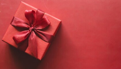 top view on red gift box for christmas or valentine s day on red background