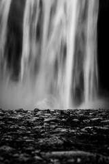 Vertical shot of silky waters in an unknown waterfall