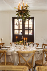 Fototapeta na wymiar Wedding table setting in a vintage building.