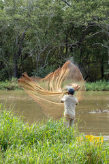 Shrimp fisherman pulling his net