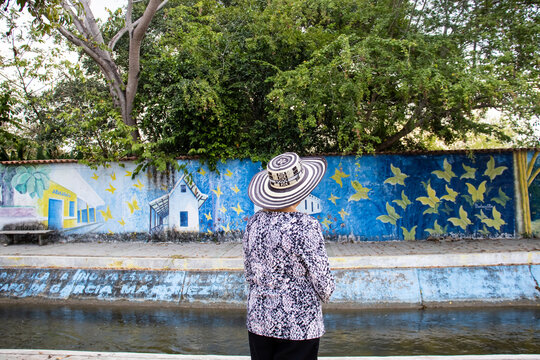 ARACATACA, COLOMBIA - FEBRUARY 2, 2024: Senior woman tourist at the Macondo Linear Park in Aracataca the birthplace of the Colombian Literature Nobel Prize Gabriel Garcia Marquez