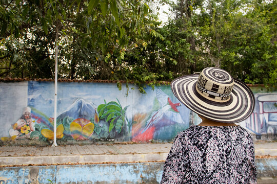 ARACATACA, COLOMBIA - FEBRUARY 2, 2024: Senior woman tourist at the Macondo Linear Park in Aracataca the birthplace of the Colombian Literature Nobel Prize Gabriel Garcia Marquez
