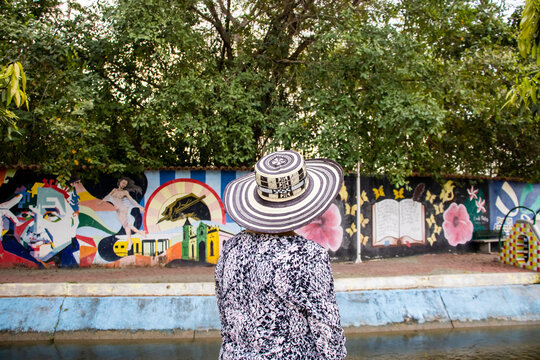 ARACATACA, COLOMBIA - FEBRUARY 2, 2024: Senior woman tourist at the Macondo Linear Park in Aracataca the birthplace of the Colombian Literature Nobel Prize Gabriel Garcia Marquez