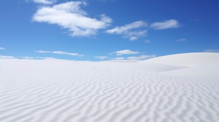 Beautiful white sand dunes on a background of the blue sky
