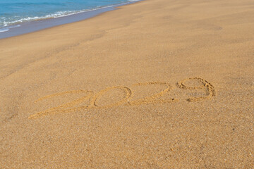 2029 written in the sand on the beach - Happy New Year  