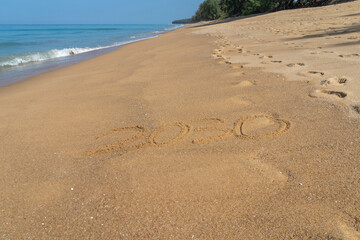 2030 written in the sand on the beach - Happy New Year  