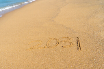 2031 written in the sand on the beach - Happy New Year