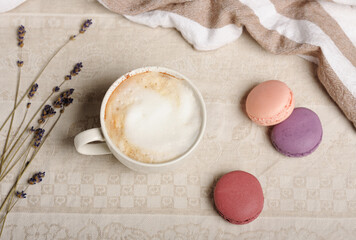 Cup with macaroons and dry lavender