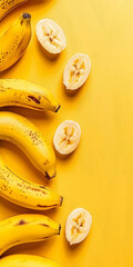 Yellow background decorated with fresh bananas with space for text